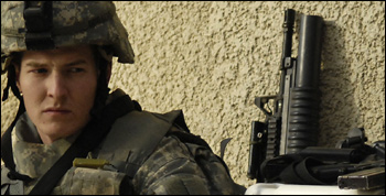 U.S. Army Spc. Cory Barton relaxes before going on a joint foot patrol with Iraqi army soldiers in Buhriz, Iraq, on Feb. 15, 2007. DoD photo by Staff Sgt. Stacy L. Pearsall, U.S. Air Force